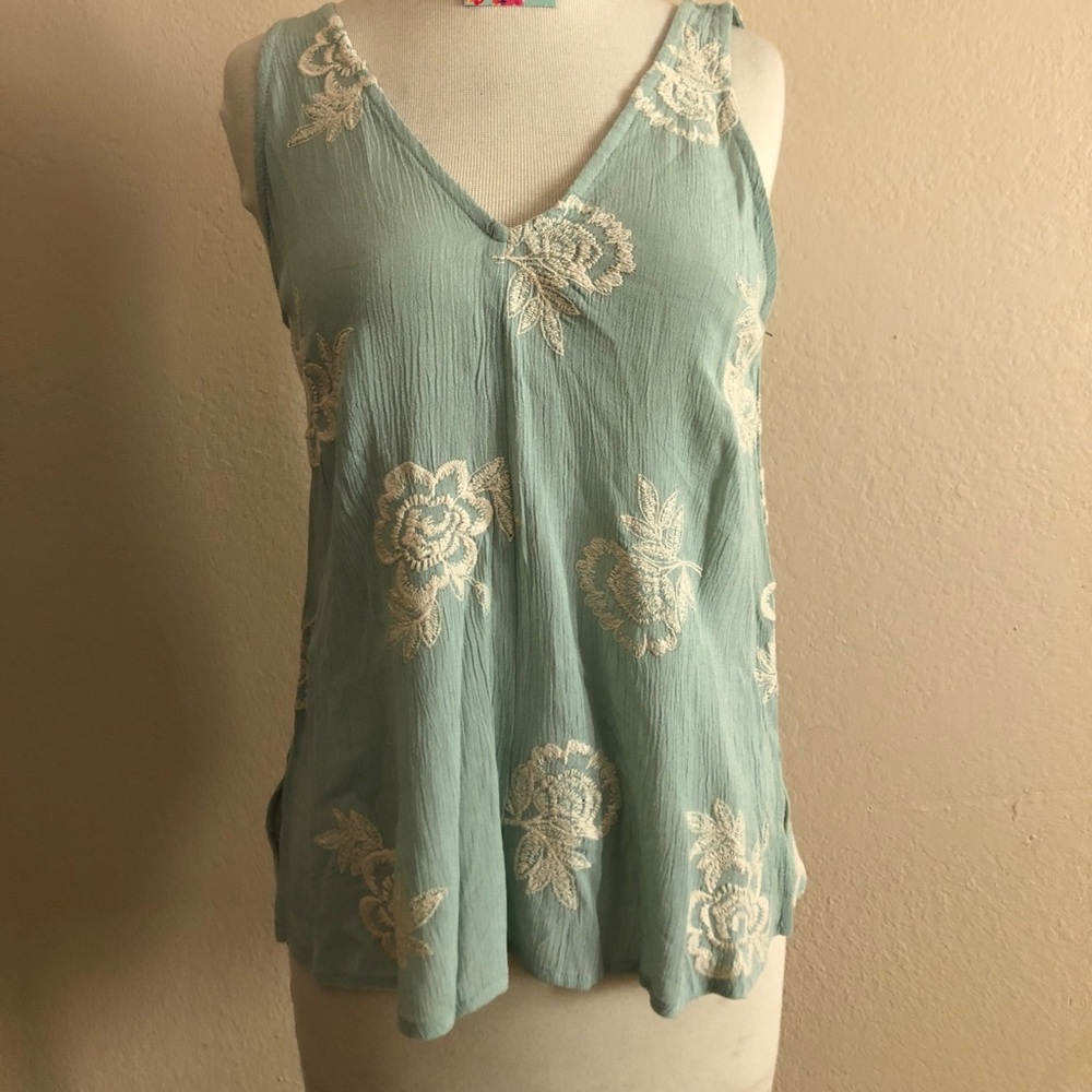 Teal top with white embroidery flowers size small